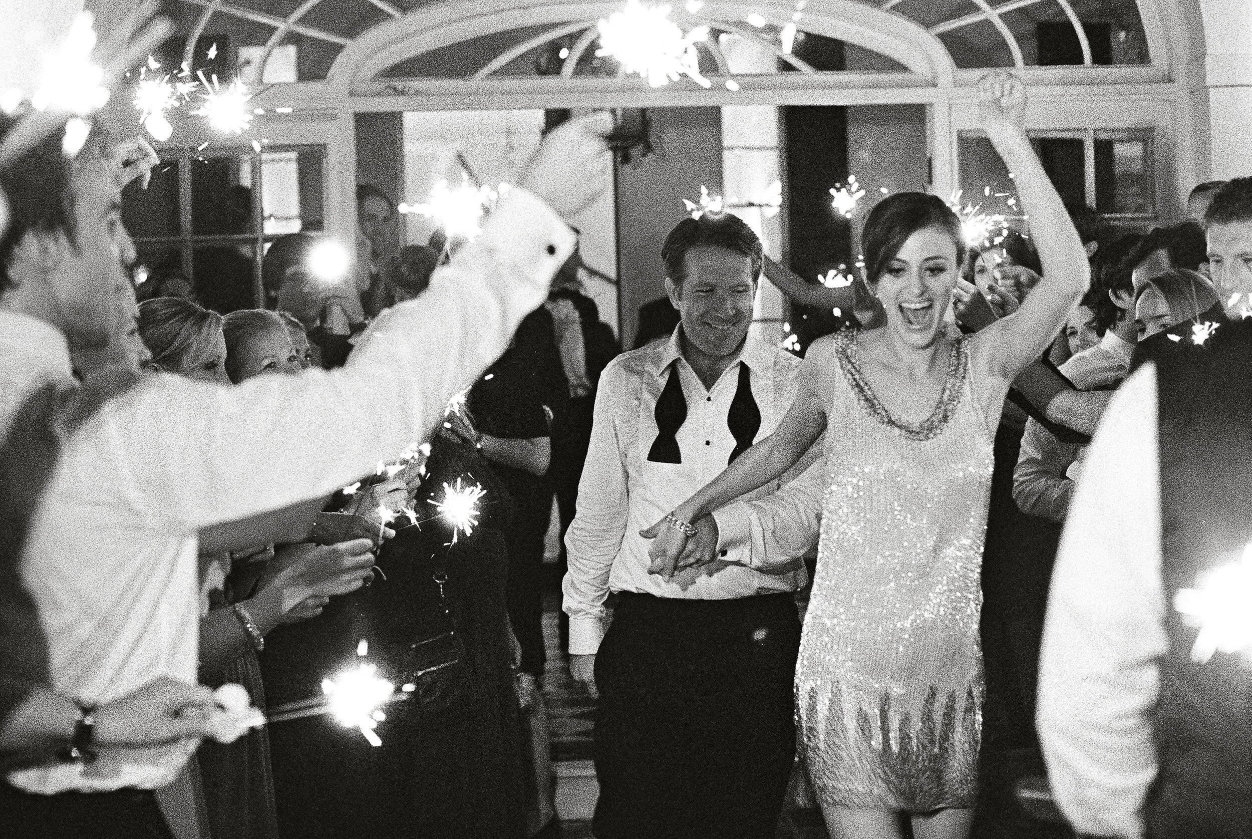 A cute short dress for the sparkler exit! End of the night joy at Lowndes Grove in Charleston, SC. Planning by Tara Guérard. #funweddings #sparklers #blacktie #lowndesgrove #taraguerard