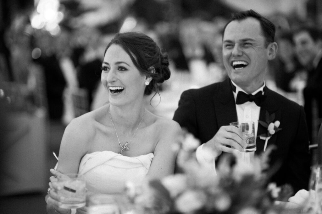 bride-and-groom-laughing-during-toasts-at-sea-island-wedding
