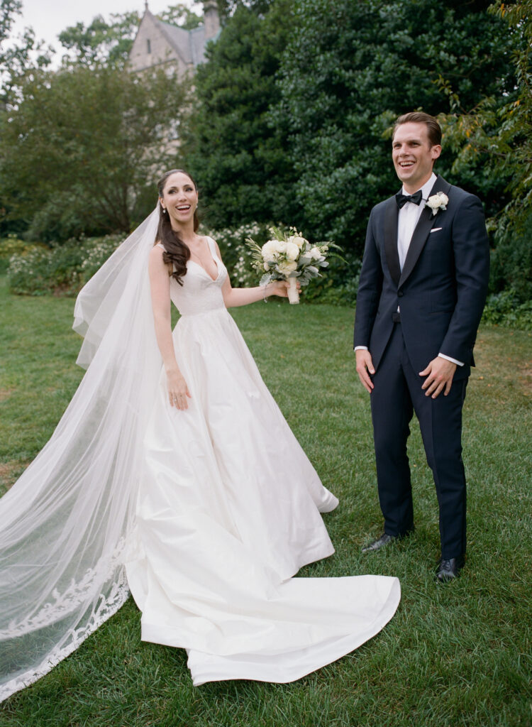 bride-and-groom-laughing-as-they-get-ready-to-get-married-liz-banfield