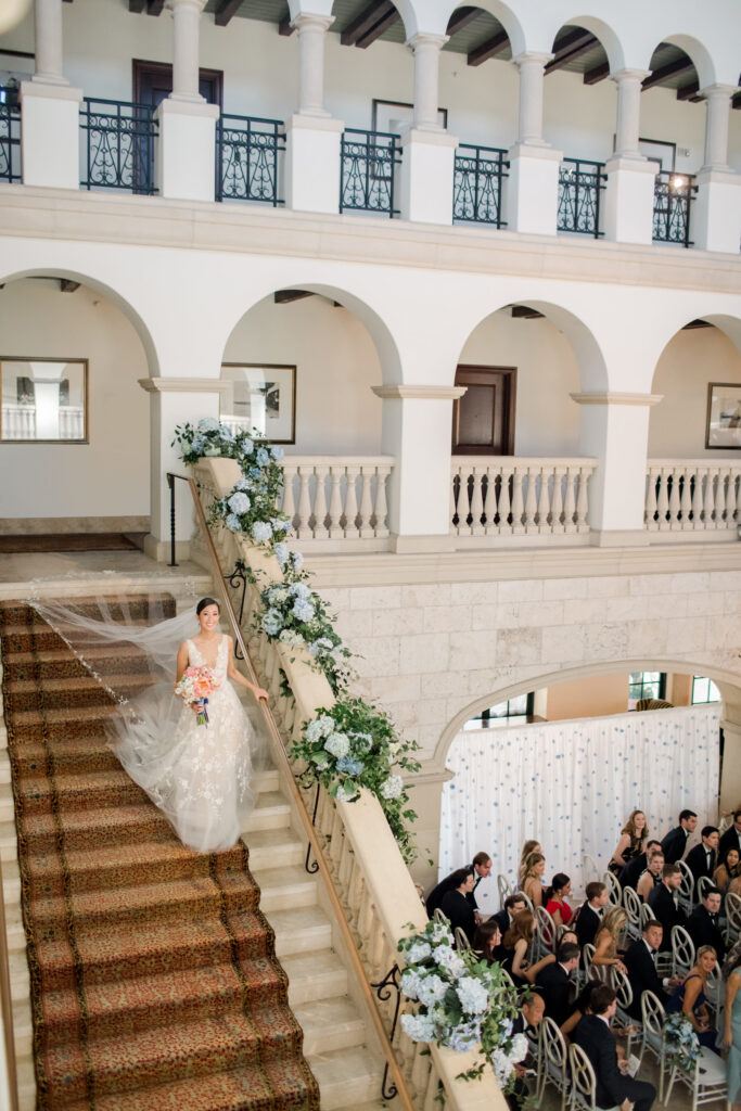 bride-walking-down-the-stairs-at-a-wedding-at-sea-island

