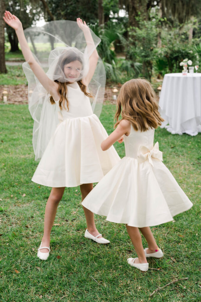 flower-girls-playing-with-the-bride-veil